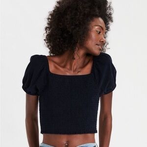 American Eagle Outfitters navy smocked corduroy puff sleeve top.
